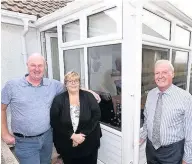  ??  ?? Living space Gavin and Teresa Parslow of Girvan with Tom Callaghan admiring their new, additional living space