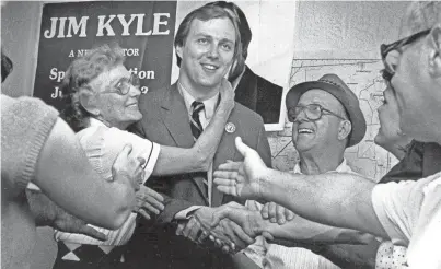  ?? PHOTO COURTESY JIM KYLE ?? Jim Kyle celebrates his election to the State Senate from District 28 with his parents Louise and Jimmy Kyle and other well wishers on 10 June 1983.