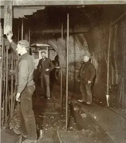  ??  ?? Miners take a pit cage to the surface at Clifton Colliery, Nottingham­shire, c1895