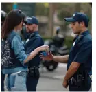  ?? Composite: Pepsi ?? A still from the Pepsi advert featuring Kendall Jenner handing a can to a police officer.