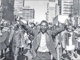  ?? Photos: Gallo Images/ Rapport archives) ?? Land of sorrow: The June 1976 uprising (above). Ingoapele Madingoane’s poem, The Black Trial, makes reference to ‘flames of soweto’.