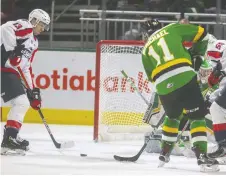  ?? MIKE HENSEN ?? Wyatt Johnston, right, here making a pass to set up a goal by Will Cuylle of the Spitfires, is going to the U20 World Juniors camp.