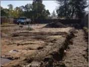  ?? PHOTOS BY MICHAEL WEBER — ENTERPRISE-RECORD ?? A trench is dug out of the ground for drainage at the Everhart Village project site on Wednesday in Chico.