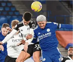  ?? — AP ?? Up for the challenge: Fulham’s Antonee Robinson (front left) and Leicester’s Wesley Fofana (right) tussle for a header.