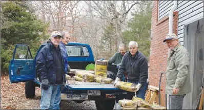  ?? ?? Fly Tyers Steve Bradbury, Doug Hanson, Scott Hawes, Erin Henkel and Fred Limberg unload supplies needed to build fish habitat in Bella Vista lakes. (Submitted Photo/John Nuttall)