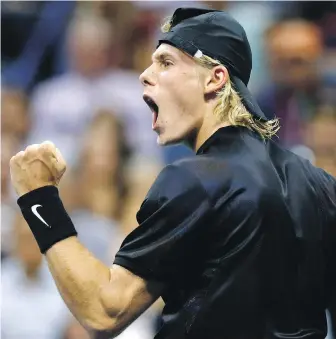  ??  ?? Canadian Denis Shapovalov celebrates after winning the opening set against France’s Jo-Wilfried Tsonga at the U.S. Open in New York on Wednesday.