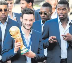  ??  ?? Prize: Hugo Lloris (left) next to Paul Pogba in Paris yesterday