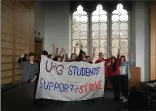  ??  ?? University of Glasgow protesters take part in a sit-in as part of the UK-wide strike action