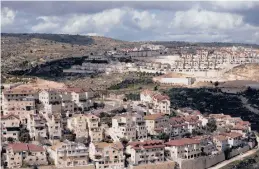  ?? MAYA ALLERUZZO/AP ?? The Jewish settlement of Efrat stands in the West Bank. Israel is set to advance plans for the constructi­on of 4,000 new settler homes in the occupied West Bank.