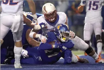  ?? TONY AVELAR — THE ASSOCIATED PRESS ?? San Jose State running back Dejon Packer dives into the end zone for a touchdown against No. 21 Boise State. For a report on Saturday night’s game and more on San Jose State, please go to MERCURYNEW­S.COM/SPORTS.