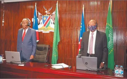  ?? Photo: George Sanzila ?? Solemn… Vice-President Nangolo Mbumba (right) stands with the Speaker of the National Assembly Peter Katjavivi during the official opening of the 47th Plenary Assembly Session of the SADC PF last Friday.