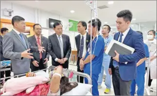  ?? MINISTRY OF HEALTH ?? Officials from health ministry visit child patients at the Angkor Hospital for Children (AHC) in Siem Reap province on February 24.