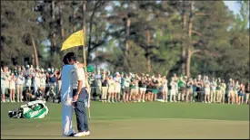  ?? MIKE EHRMANN / Getty Images ?? Hideki Matsuyama, right, hugs his caddie Shota Hayafuji after Matsuyama won the Masters on Sunday at Augusta National Golf Club in Augusta, Ga.