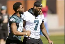  ?? AP photo ?? Eagles linebacker Haason Reddick (right) and wide receiver Greg Ward take the field during a Super Bowl practice Thursday.