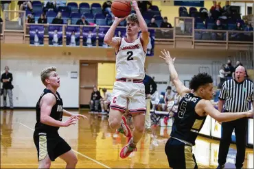  ?? CONTRIBUTE­D BY JEFF ?? Cedarville High School senior Trent Koning shoots over Botkins’ Jayden Priddy-Powell (right) and Zane Paul during Friday night’s Division IV regional final in Vandalia. Koning scored 14 points, but the Indians lost 42-40.