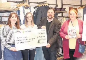  ??  ?? Giving thing Hannah Dickson and Ruth Bradley, from Fatface, present the cheque to Kevin Harrison and Artlink volunteer Eleanor Macleod