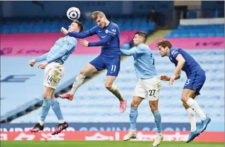 ?? AFP ?? Chelsea’s German striker Timo Werner (second left) vies with Manchester City’s French defender Aymeric Laporte (left) and its Portuguese defender Joao Cancelo (second right) during the English Premier League football match on Saturday.