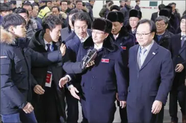  ?? JEON HEON-KYUN/AFP ?? A North Korean delegation of 32 people, including 10 athletes from the North Korean Olympic team, arrives at Yangyang internatio­nal airport near Gangneung in South Korea yesterday.