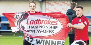  ??  ?? Brechin City’s Ally Love and Finn Graham celebrate their promotion.