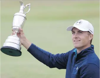  ?? GREGORY SHAMUS/GETTY IMAGES ?? Jordan Spieth poses with the Claret Jug on a bunker on the 18th green after winning the British Open by three strokes at Royal Birkdale in Southport, England, on Sunday.