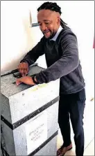  ?? ?? Tebogo Obusitse, who collected 375 CVS from job seekers in Galeshewe, made sure they were all placed in the collection box at the District Department of Education. Picture: Soraya Crowie