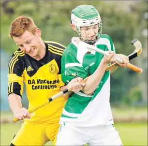  ?? Photo: Donald Cameron ?? Inveraray’s Ali MacDonald and Beauly’s Robbie Brindle in a tussle during last Saturday’s Camanachd Cup tie at Braeview Park.