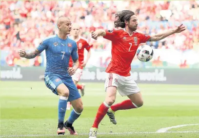  ??  ?? Slovakia’s Vladimir Weiss and Wales’ Joe Allen battle for possession at the Stade de Bordeaux last night PICTURE: PA