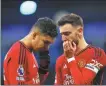  ?? REUTERS ?? Casemiro (left) and Bruno Fernandes cut dejected figures after United’s derby defeat.