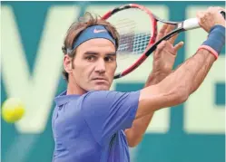  ?? Picture: Getty Images. ?? Roger Federer during his straightfo­rward victory in Halle yesterday over Ernests Gulbis.