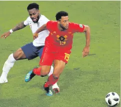  ??  ?? Flat affair: England’s Danny Rose (left) and Belgium’s Mousa Dembele battle for possession