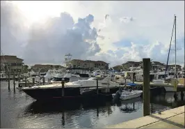  ?? LARRY AYDLETTE / THE PALM BEACH POST ?? The marina and condos today in The Bluffs, part of a developmen­t of seven communitie­s in Jupiter.