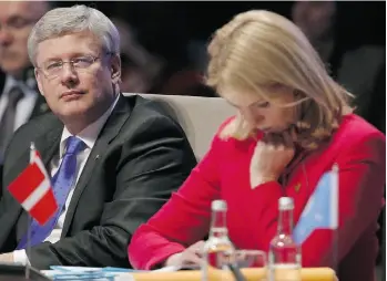  ?? YVES HERMAN/Agence France-Press e/Getty Images ?? Prime Minister Stephen Harper and Denmark’s Prime Minister Helle Thorning-Schmidt attend the opening session of the Nuclear Security Summit (NSS) in The Hague on Monday.