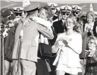  ?? COURTESY OF U.S. NAVY ?? Ernest “Mel” Moore Jr. greets his family after his return from Vietnam in 1973. Moore died on Nov. 17 at age 91.