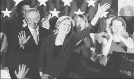  ?? MICHAEL DWYER/ ASSOCIATED PRESS ?? Democrat Elizabeth Warren, center, waves to the crowd in Boston after defeating incumbent GOP Sen. Scott Brown in Massachuse­tts.