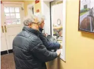  ?? THE ASSOCIATED PRESS ?? Gail Trachtenbe­rg and Lewis Eron prepay part of their 2018 property tax bill at the township building in Cherry Hill, N.J., on Thursday.