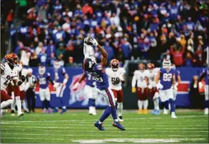  ?? John Munson / Associated Press ?? New York Giants’ Darius Slayton makes a catch during the second half against the Washington Commanders on Sunday in East Rutherford, N.J. Slayton is looking forward to facing former teammate and friend James Bradberry on Sunday.