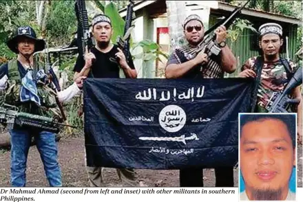  ??  ?? Dr Mahmud Ahmad (second from left and inset) with other militants in southern Philippine­s.