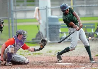  ?? SARAH GORDON/THE DAY ?? Angel Ovalle of the Knights swings at a pitch as Pirates catcher Josh Gurnack during an Eastern Connecticu­t Major League game on Sunday at Washington Park in Groton.