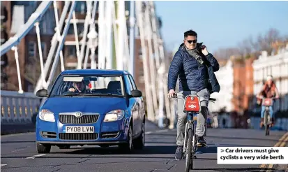  ?? ?? Car drivers must give cyclists a very wide berth