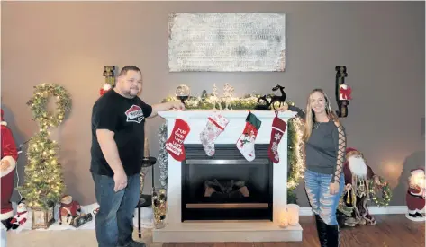  ?? DAVE JOHNSON/ WELLAND TRIBUNE ?? Sean and Sylvia Corcoran opened up their Killaly Street East home Saturday in Port Colborne to people who came out for the St. James- St. Brendan Anglican Church’s 10th annual Christmas House Tour.