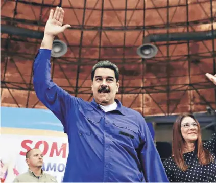  ??  ?? ► El Presidente Nicolás Maduro y su esposa, Cilia Flores, en un acto el jueves en Maracay.