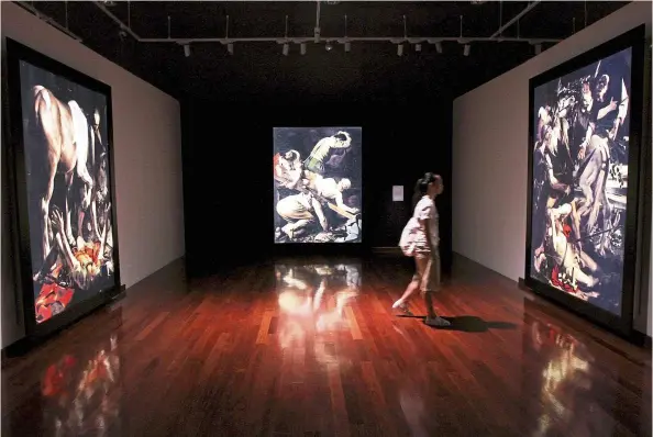  ??  ?? There is a distinct ambience at the Caravaggio exhibit with the low lights giving the show an intense atmospheri­c feel. — LOW LAY PHON/The Star