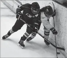  ??  ?? A Subway defender fights for the puck along the boards.