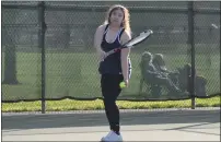  ??  ?? Orland High School’s Gaby Martinez prepares to hit a serve in her match against Chico High’s Lilly Golia on Thursday at the Community Park tennis courts in Chico.