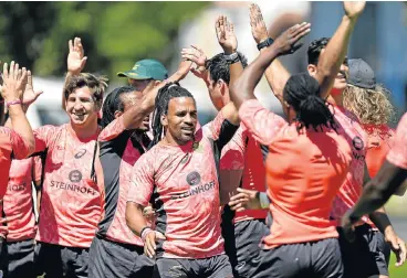  ?? /Ashley Vlotman/Gallo Images ?? Fives high: Rosko Specman, centre, and Kwagga Smith, left, celebrate with their Blitzboks teammates after a training session ahead of this weekend’s tournament in Cape Town.