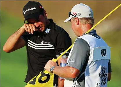  ??  ?? No holding back: the scale of his achievemen­t hits Jason Day as caddie Colin Swatton looks on