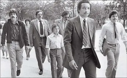  ?? SUN-TIMES LIBRARY ?? Walter Polovchak, 12, heads for court with his lawyers. He refused to return to the Soviet Union with his parents in 1980 because he liked American life. He was allowed to stay.