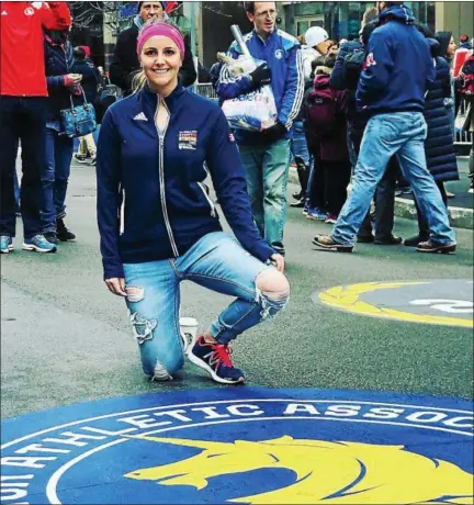  ?? PHOTOS COURTESY ALLIE MACNEILL ?? Above, Phoenixvil­le native Allie MacNeill poses for a photo near the Boston Marathon finish line on Boylston Street in dowtown Boston. Below, MacNeill shows off her Boston Marathon finishers medal.