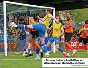  ?? Dave Crawford/PPAUK ?? Torquay United’s Asa Hall has an attempt at goal blocked by Eastleigh