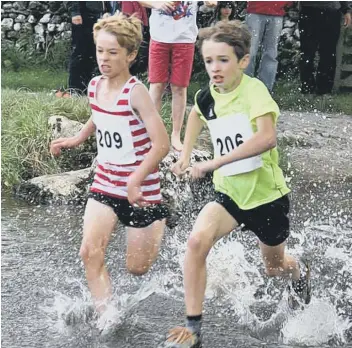  ??  ?? Calder Valley’s young star James Duffy (no 209) winning his age group at Malham Show